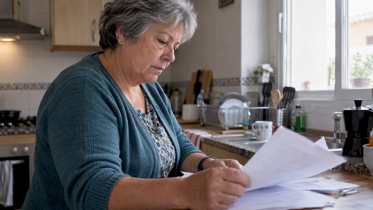 Torremolinos homeowner reviewing sale paperwork