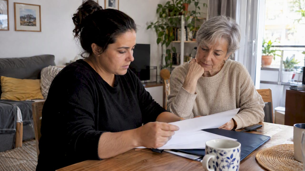 Buyer and aunt reviewing a mortgage guarantee